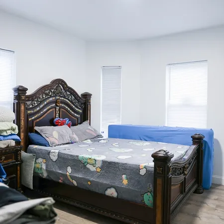 a bedroom with a bed and a closet
