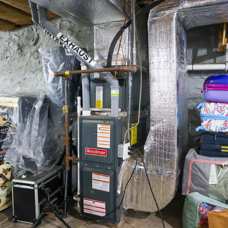 84 Cambridge Street Lowell, MA 01851 - Photo 36 of 42 a building with table and chairs