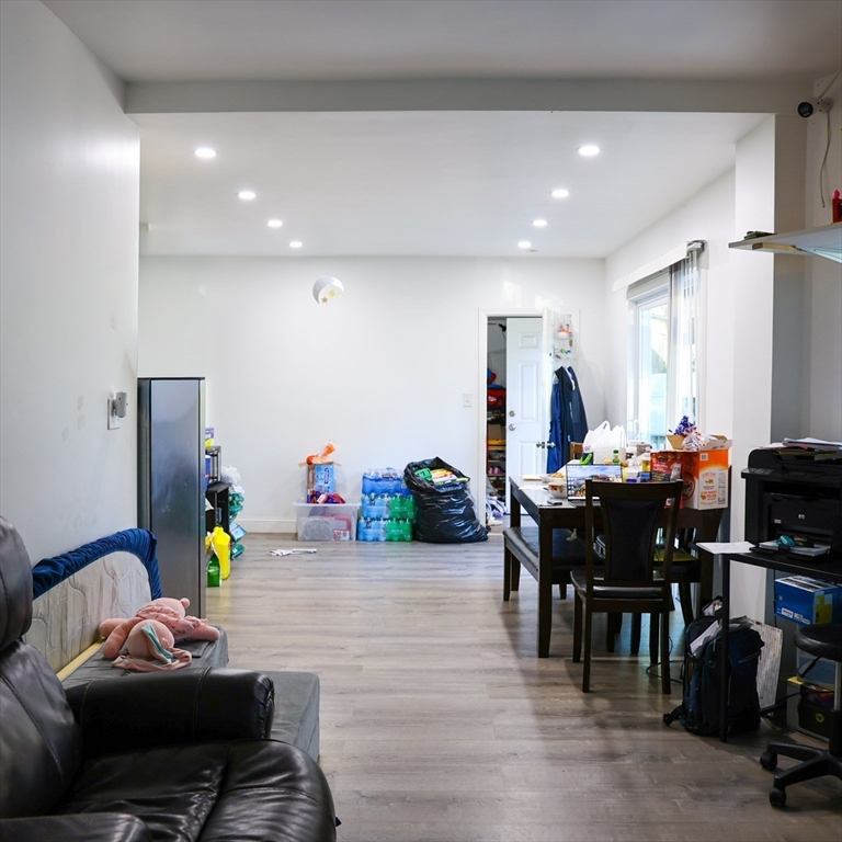 84 Cambridge Street Lowell, MA 01851 - Photo 10 of 42 a living room with furniture and wooden floor