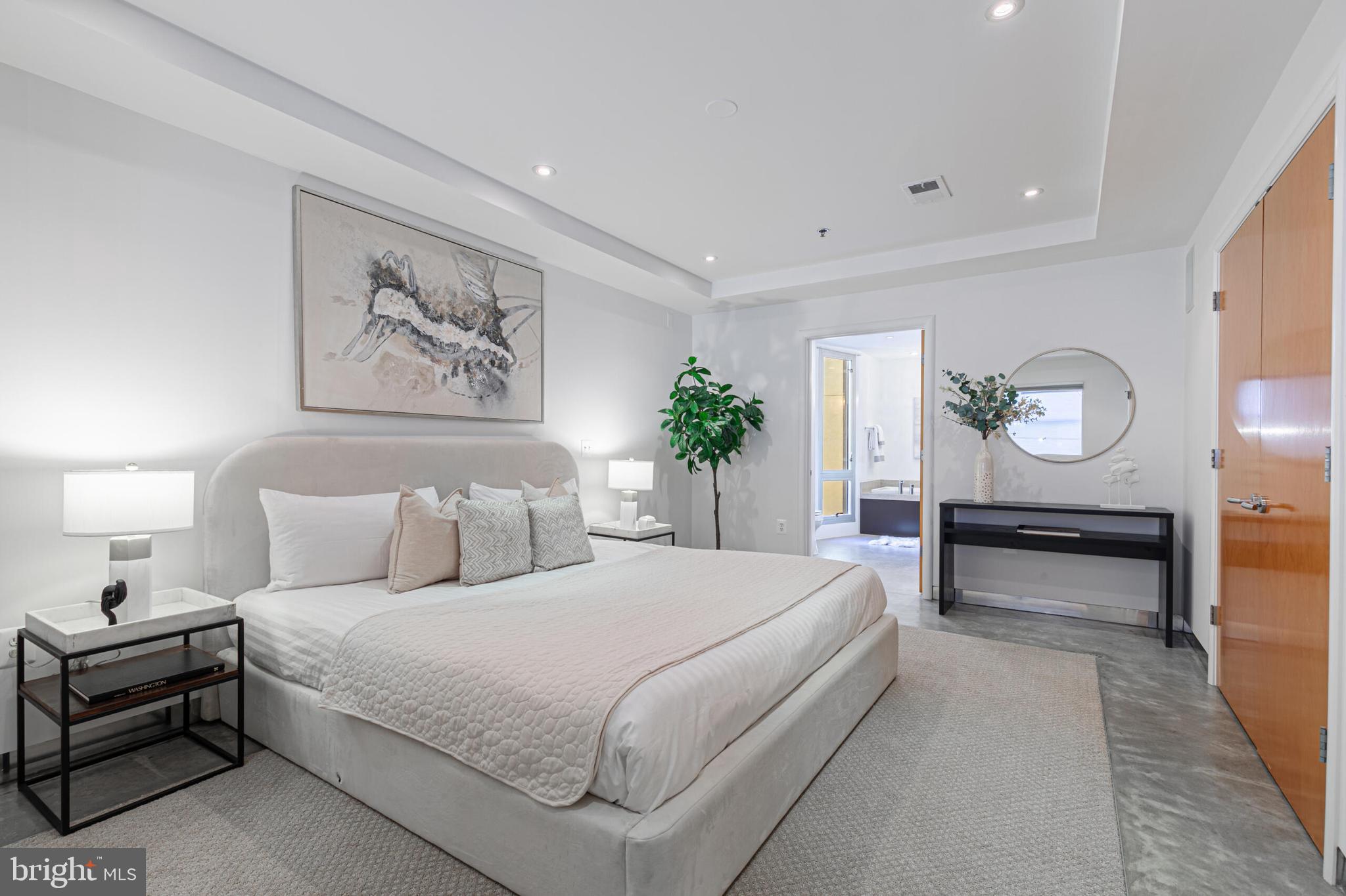 2351 Champlain Street Northwest, Unit C1 Washington, DC 20009 - Photo 20 of 34 a bedroom with bed and a large mirror