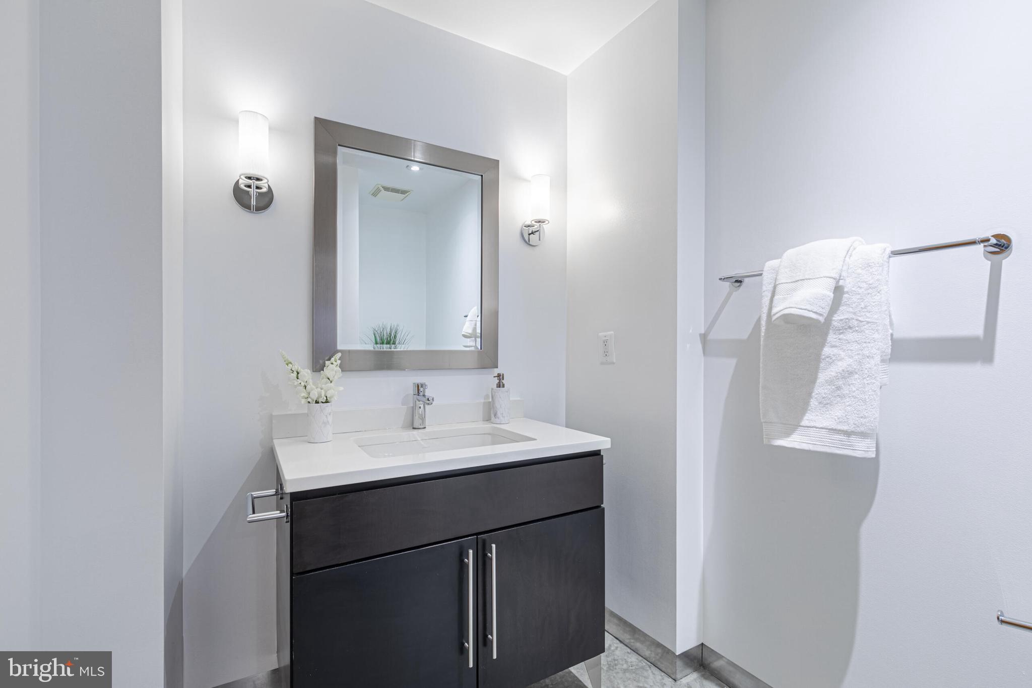 2351 Champlain Street Northwest, Unit C1 Washington, DC 20009 - Photo 27 of 34 a bathroom with a sink and a mirror