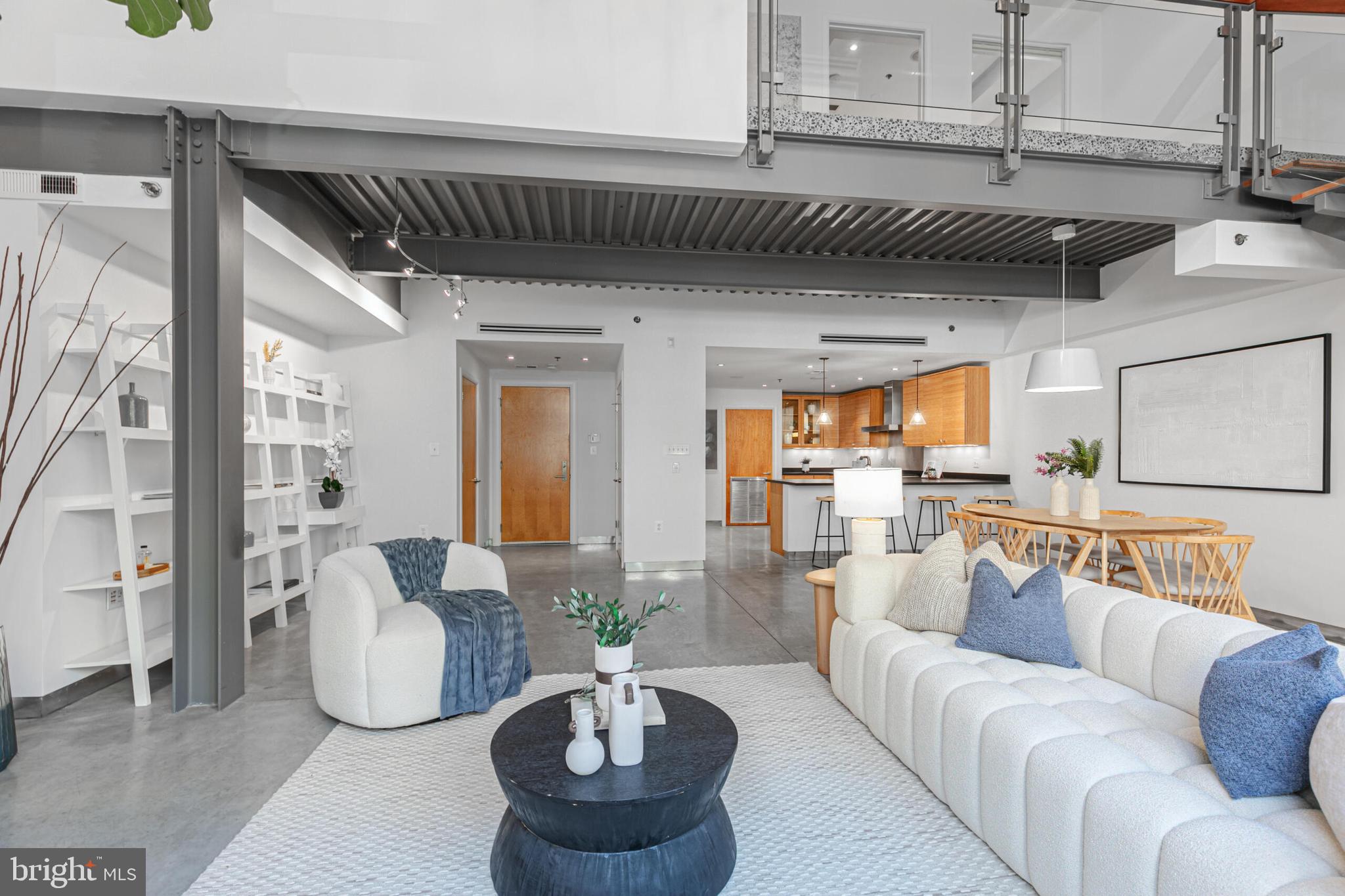 2351 Champlain Street Northwest, Unit C1 Washington, DC 20009 - Photo 6 of 34 a living room with furniture and a chandelier