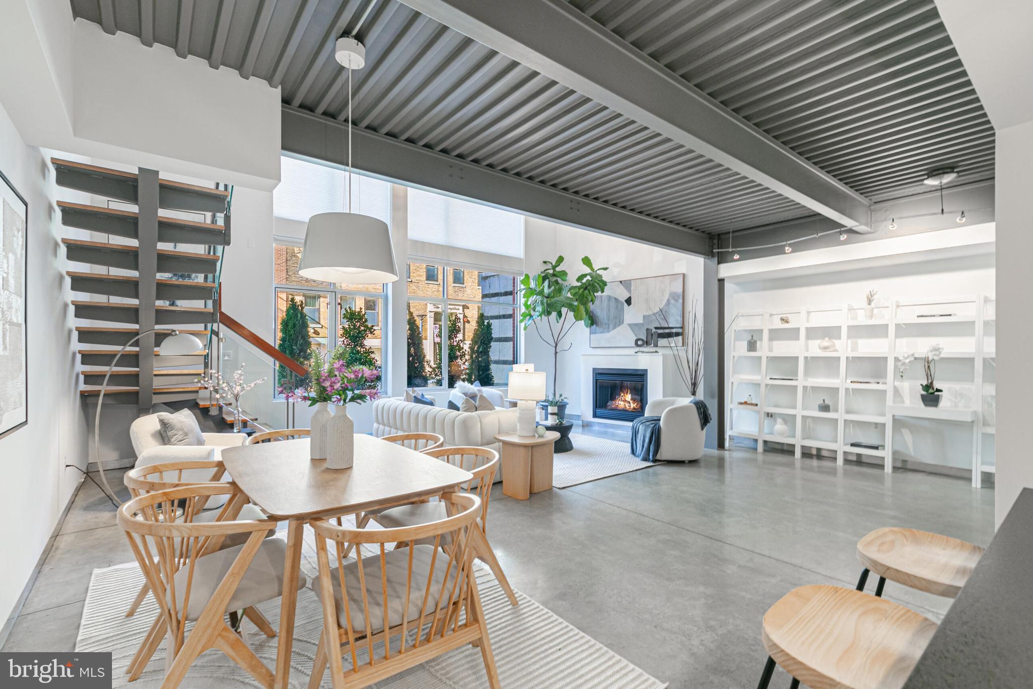 2351 Champlain Street Northwest, Unit C1 Washington, DC 20009 - Photo 7 of 34 a dining room with furniture a fireplace and wooden floor