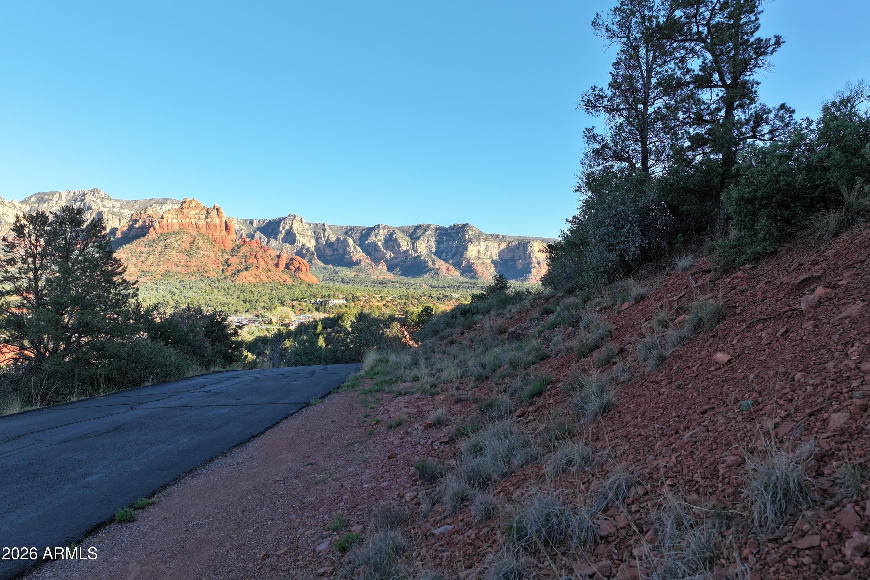 256 Barcelona Road, Unit 81 Sedona, AZ 86336 - Photo 10 of 14 a view of a yard with wooden fence
