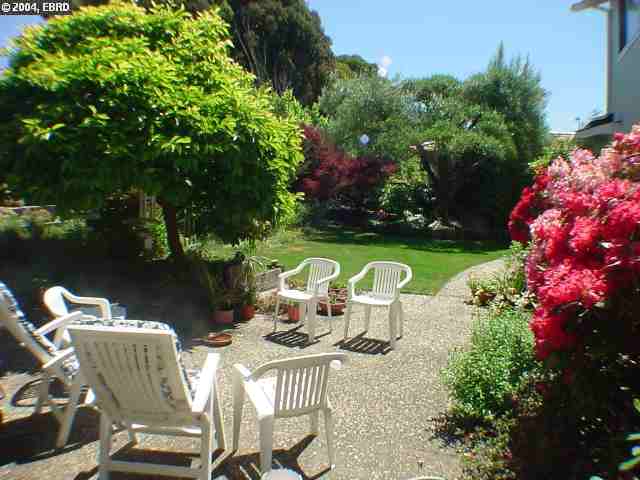 4931 Santa Rita Road Richmond, CA 94803 - Photo 3 of 4 a view of a chair and table on the backyard