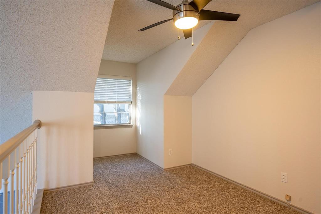 17735 Windflower Way, Unit 105 Dallas, TX 75252 - Photo 18 of 32 an empty room with a window and a fan