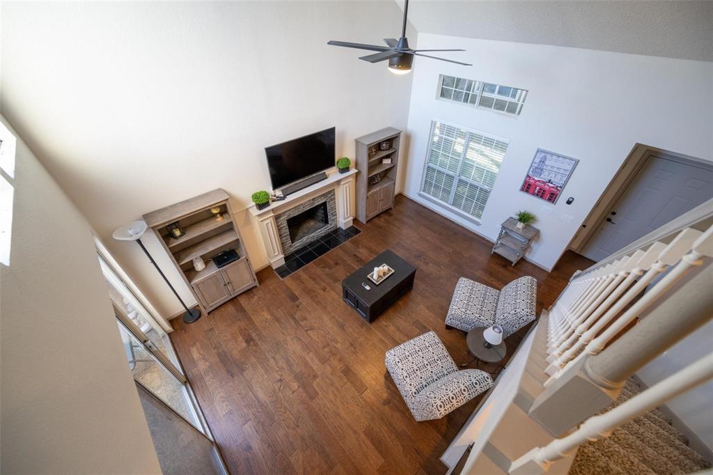 17735 Windflower Way, Unit 105 Dallas, TX 75252 - Photo 22 of 32 a living room with furniture and a flat screen tv