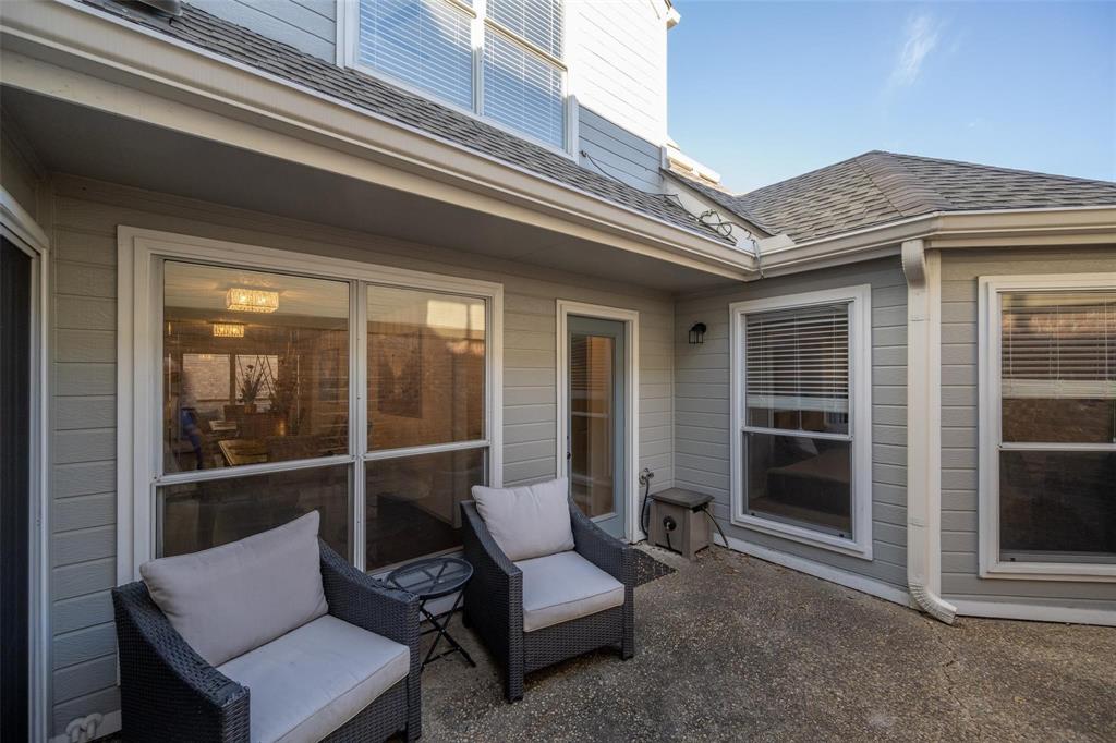 17735 Windflower Way, Unit 105 Dallas, TX 75252 - Photo 25 of 32 a balcony with furniture and a potted plant