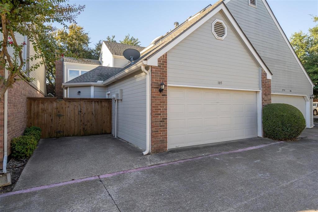 17735 Windflower Way, Unit 105 Dallas, TX 75252 - Photo 27 of 32 a view of a small house with wooden fence