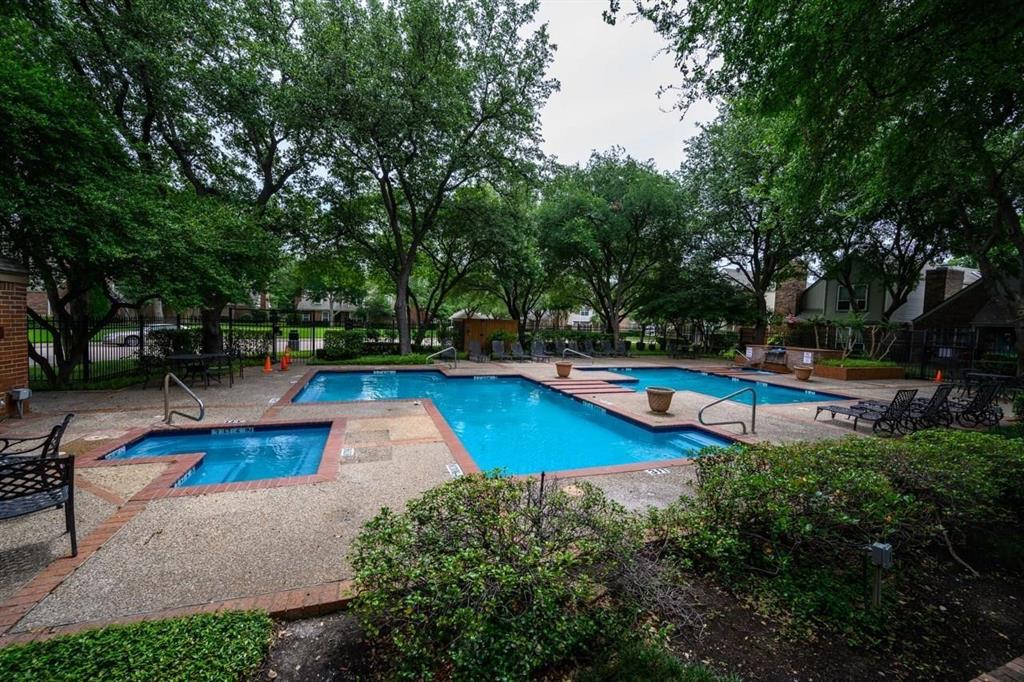 17735 Windflower Way, Unit 105 Dallas, TX 75252 - Photo 28 of 32 a view of a swimming pool with sitting area