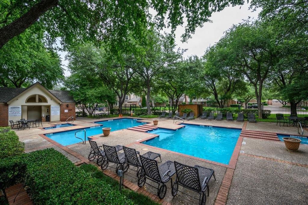 17735 Windflower Way, Unit 105 Dallas, TX 75252 - Photo 29 of 32 a view of a house with pool and chairs