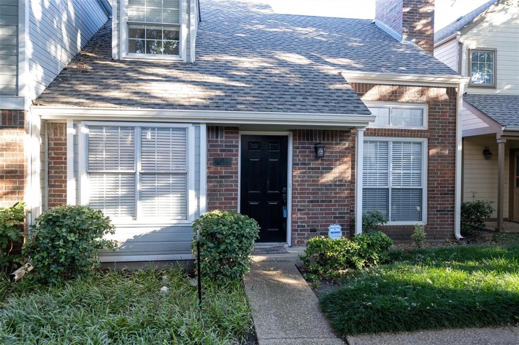 17735 Windflower Way, Unit 105 Dallas, TX 75252 - Photo 32 of 32 a view of a brick house with potted plants