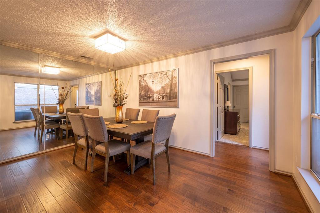 17735 Windflower Way, Unit 105 Dallas, TX 75252 - Photo 8 of 32 a view of a dining room with furniture window and wooden floor