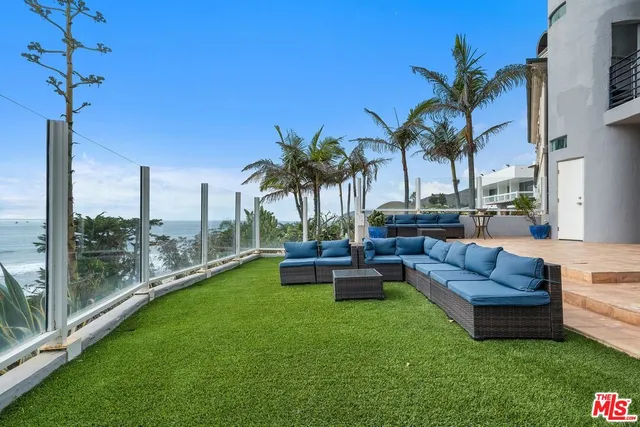 a view of a yard with patio