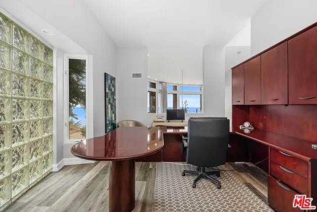 a view of a workspace with furniture and lounge chair