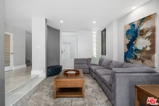 a living room with furniture and a couch