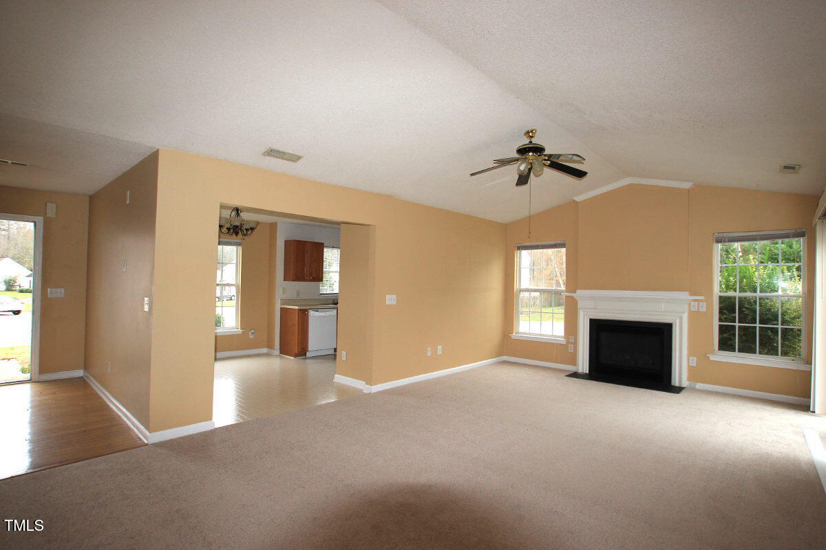 5201 Water Walk Lane Raleigh, NC 27616 - Photo 2 of 10 a view of a livingroom with a fireplace and window