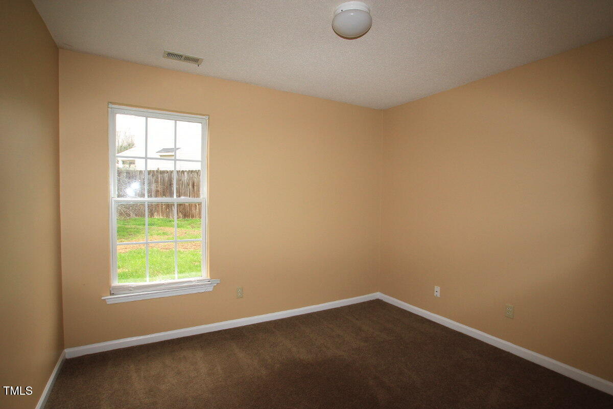 5201 Water Walk Lane Raleigh, NC 27616 - Photo 7 of 10 an empty room with a window