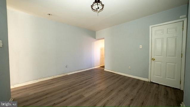 1911 Brunner Street Philadelphia, PA 19140 - Photo 3 of 12 a view of an empty room with wooden floor and a window