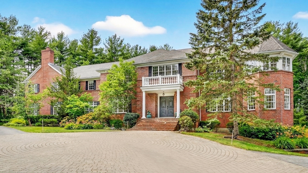 front view of a house with a garden