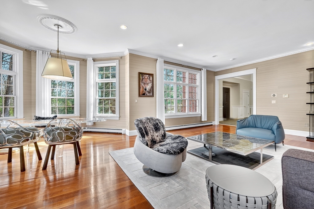 451 Wellesley Street Weston, MA 02493 - Photo 13 of 28 a living room with furniture and floor to ceiling windows