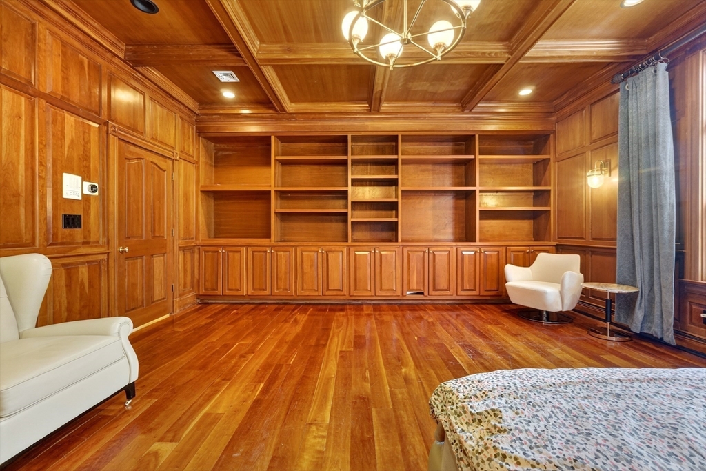 451 Wellesley Street Weston, MA 02493 - Photo 16 of 28 a view of empty room with wooden floor and windows