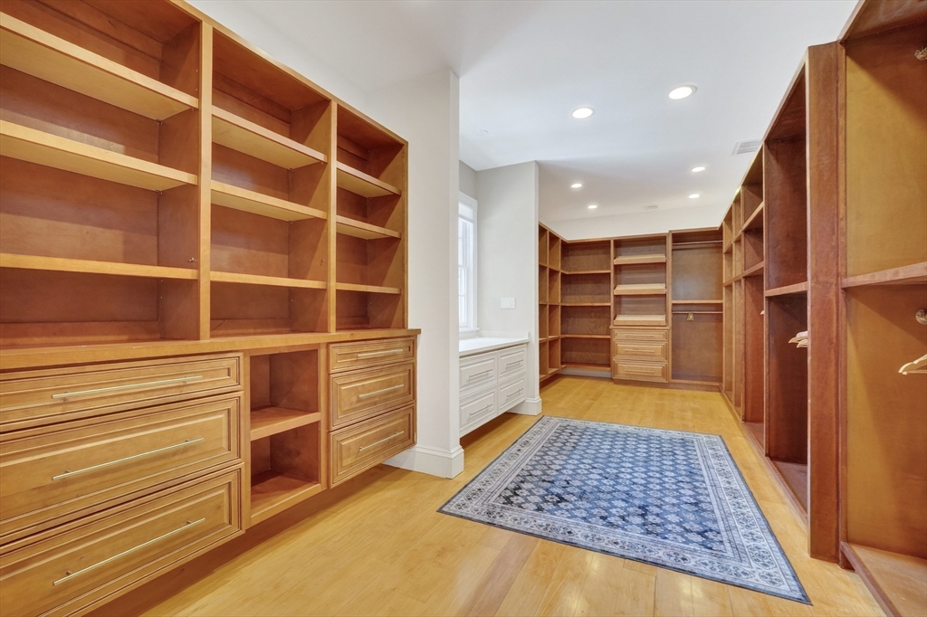 451 Wellesley Street Weston, MA 02493 - Photo 19 of 28 a view of walk in closet with empty racks