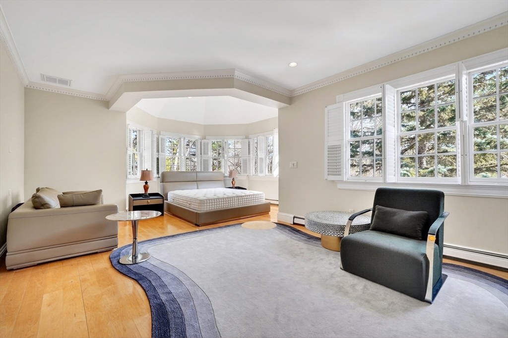 451 Wellesley Street Weston, MA 02493 - Photo 20 of 28 a bedroom with furniture and a large window