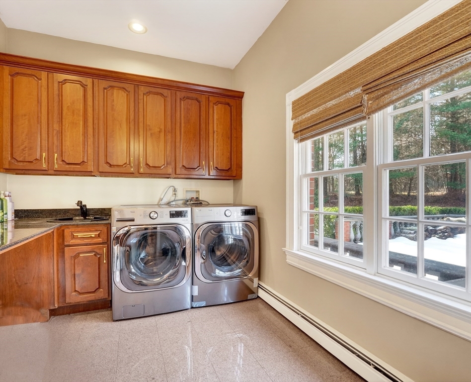 451 Wellesley Street Weston, MA 02493 - Photo 24 of 28 a utility room with sink dryer and washer