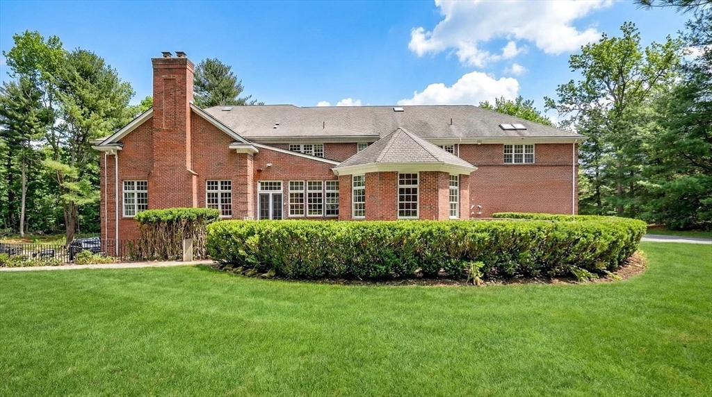 451 Wellesley Street Weston, MA 02493 - Photo 25 of 28 a front view of a house with a yard