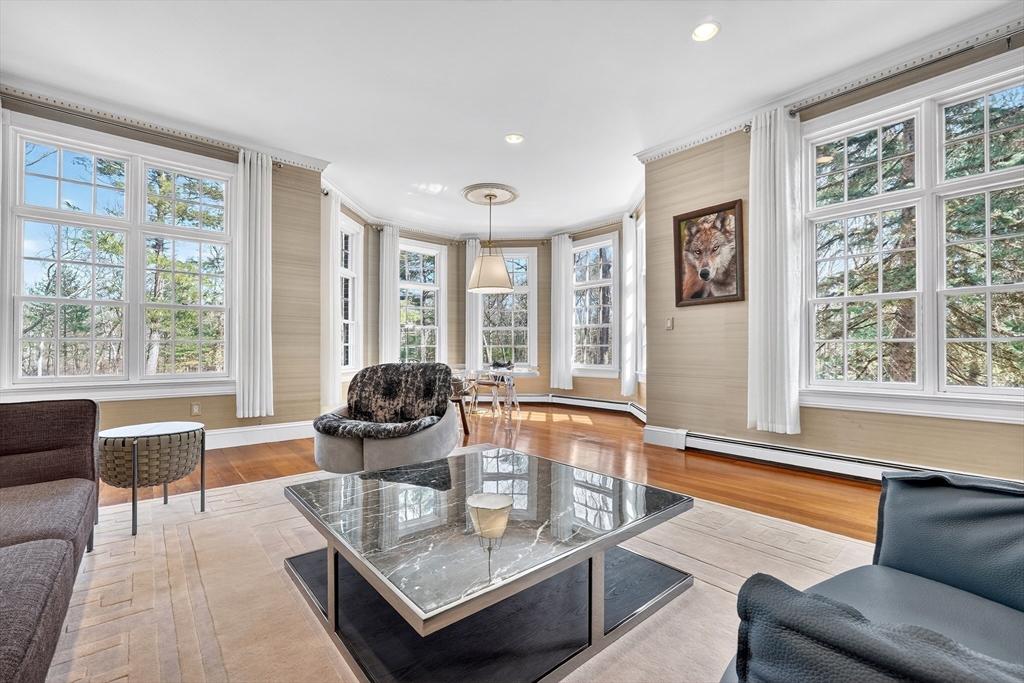 451 Wellesley Street Weston, MA 02493 - Photo 4 of 28 a living room with furniture and floor to ceiling windows