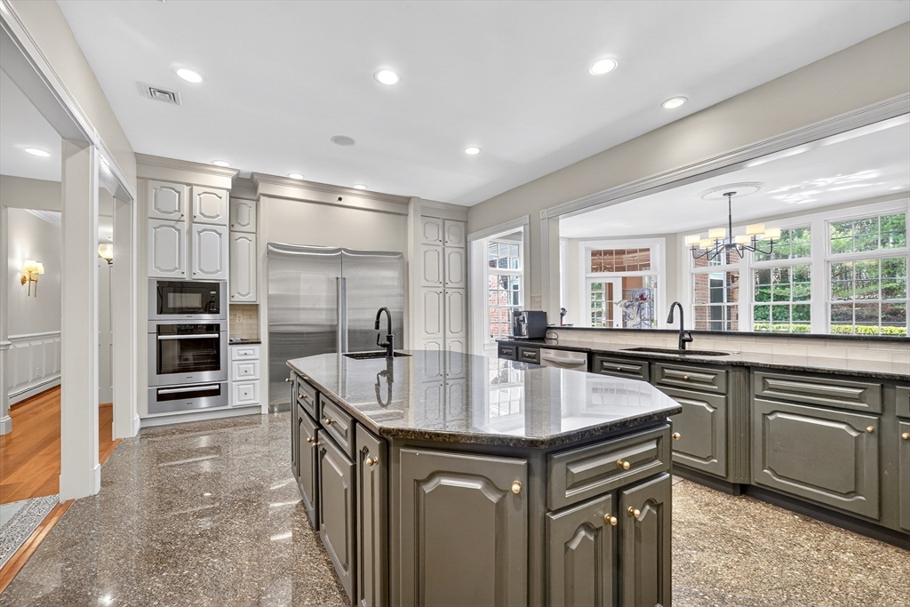 451 Wellesley Street Weston, MA 02493 - Photo 6 of 28 a kitchen with stainless steel appliances granite countertop a sink stove and refrigerator