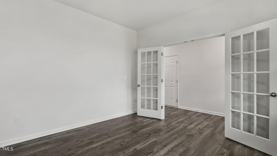 817 Comice Pear Way Willow Spring, NC 27592 - Photo 4 of 31 an empty room with wooden floor and closet