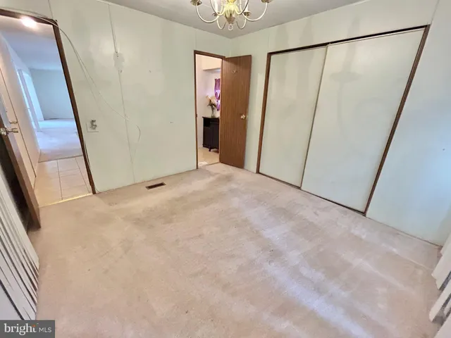 a view of a room with a glass door