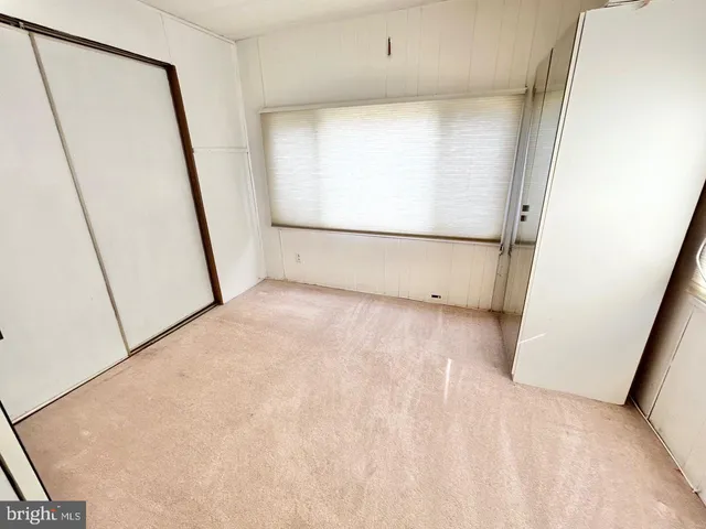 a bathroom with a sink toilet and mirror