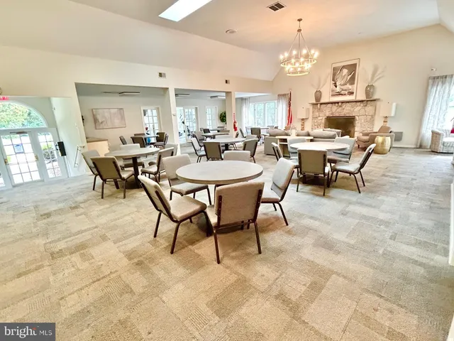 a view of a yard with plants and trees