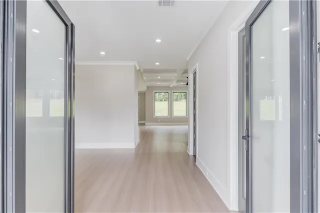 a view of hallway with wooden floor