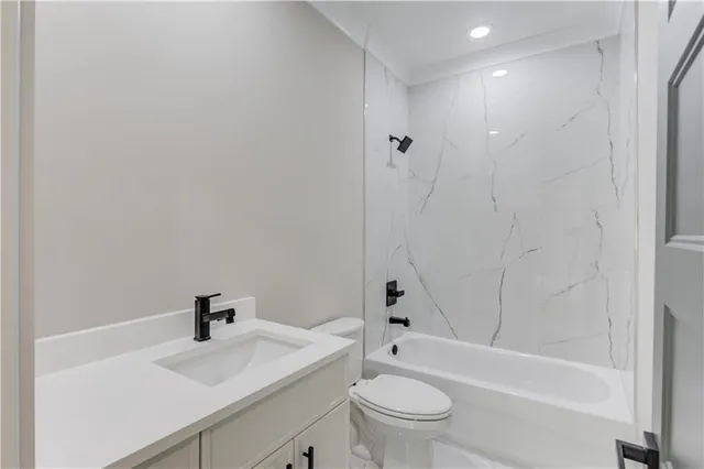 a bathroom with a sink and a window