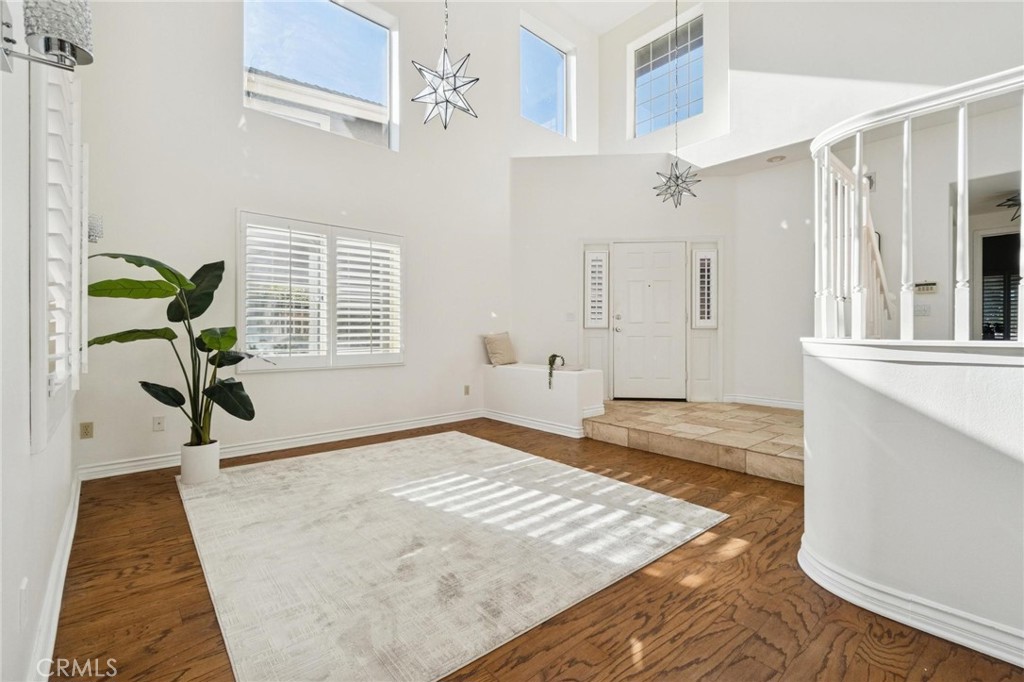 25528 Paine Circle Stevenson Ranch, CA 91381 - Photo 17 of 63 a view of a room with a window and wooden floor