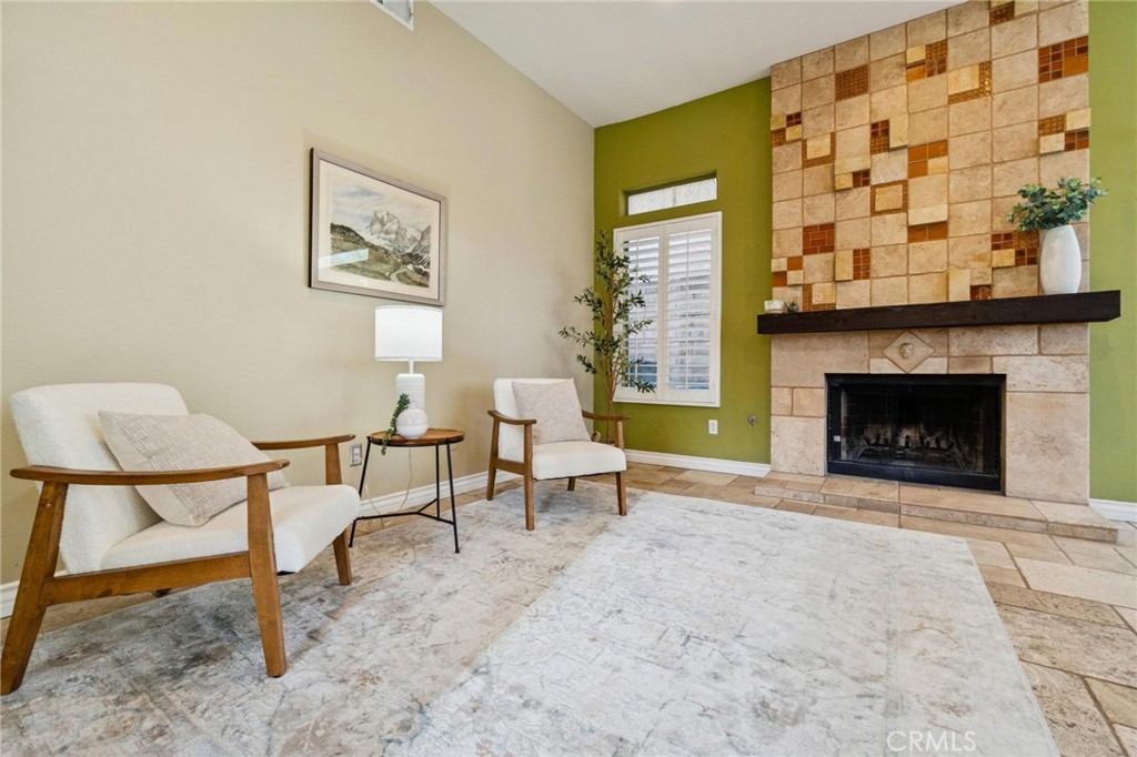 25528 Paine Circle Stevenson Ranch, CA 91381 - Photo 26 of 63 a living room with furniture and a fireplace