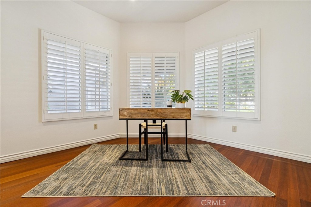 25528 Paine Circle Stevenson Ranch, CA 91381 - Photo 28 of 63 a view of a workspace with wooden floor and a window