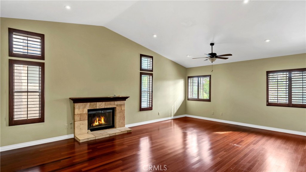 25528 Paine Circle Stevenson Ranch, CA 91381 - Photo 33 of 63 a view of an empty room with wooden floor and a window
