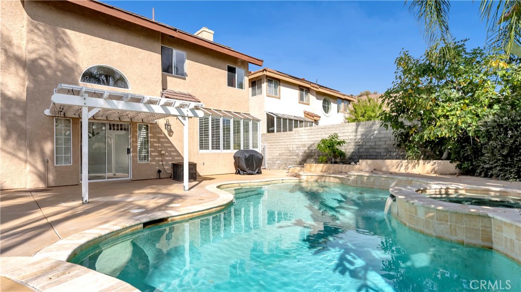 25528 Paine Circle Stevenson Ranch, CA 91381 - Photo 46 of 63 a view of a house with backyard and sitting area