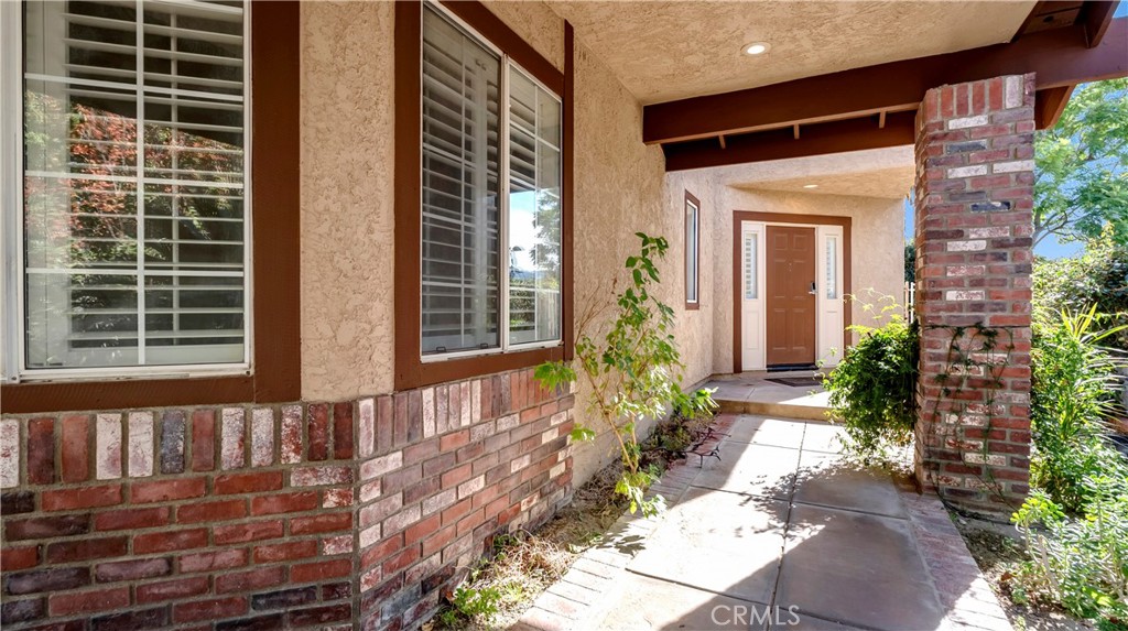 25528 Paine Circle Stevenson Ranch, CA 91381 - Photo 49 of 63 a front view of a house with a yard