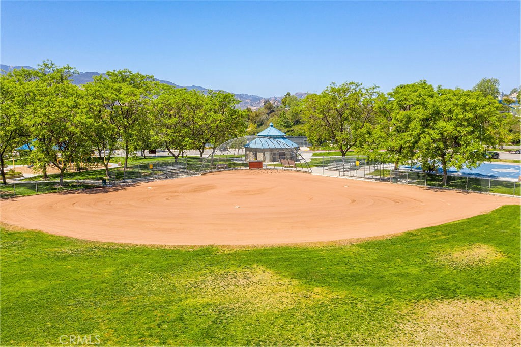 25528 Paine Circle Stevenson Ranch, CA 91381 - Photo 62 of 63 a view of a yard with a house in the background