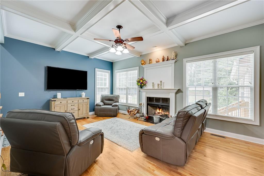 32 St Ives Circle Winder, GA 30680 - Photo 13 of 38 a living room with furniture a fireplace and a flat screen tv