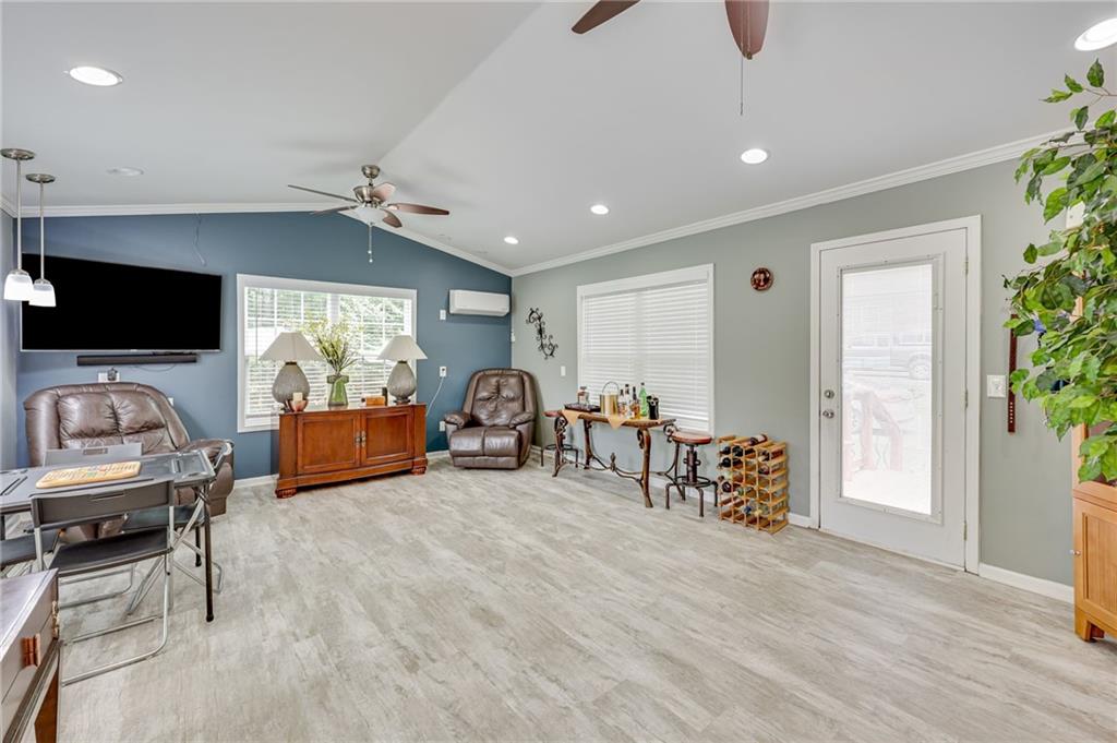 32 St Ives Circle Winder, GA 30680 - Photo 19 of 38 a view of a livingroom with furniture and a flat screen tv