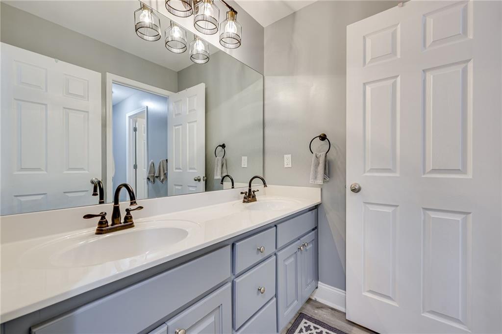 32 St Ives Circle Winder, GA 30680 - Photo 25 of 38 a bathroom with a sink and a mirror