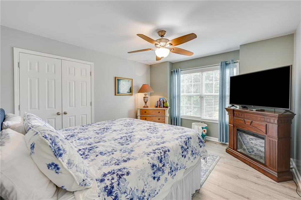 32 St Ives Circle Winder, GA 30680 - Photo 30 of 38 a bedroom with a bed and a flat screen tv