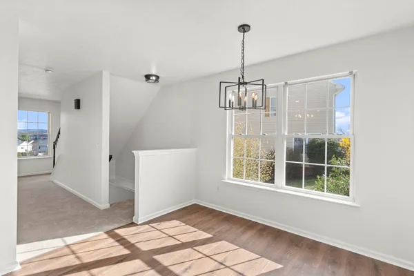 a view of an empty room with windows